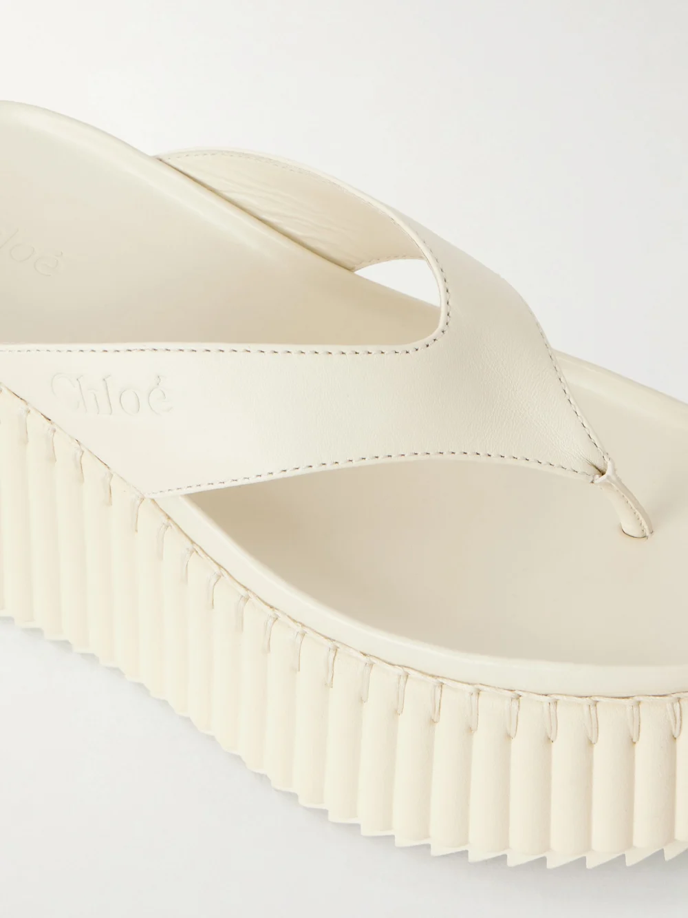 Close-up detail of the Chloé Nama Leather Platform Flip Flops
