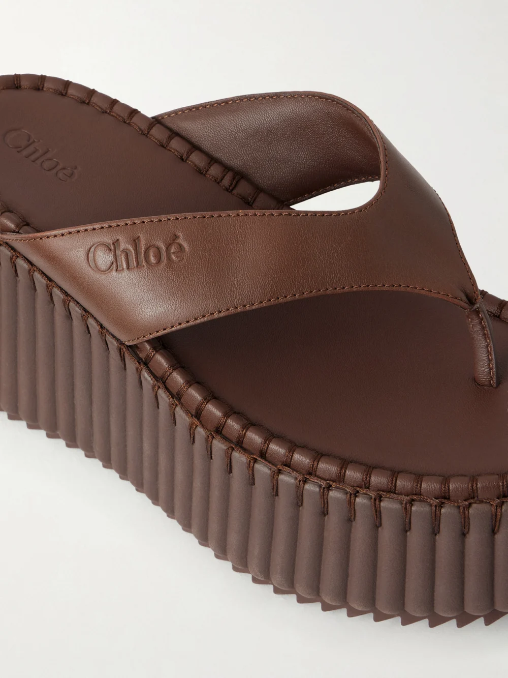 Close-up detail of the Chloé Nama Leather Platform Thong Sandals