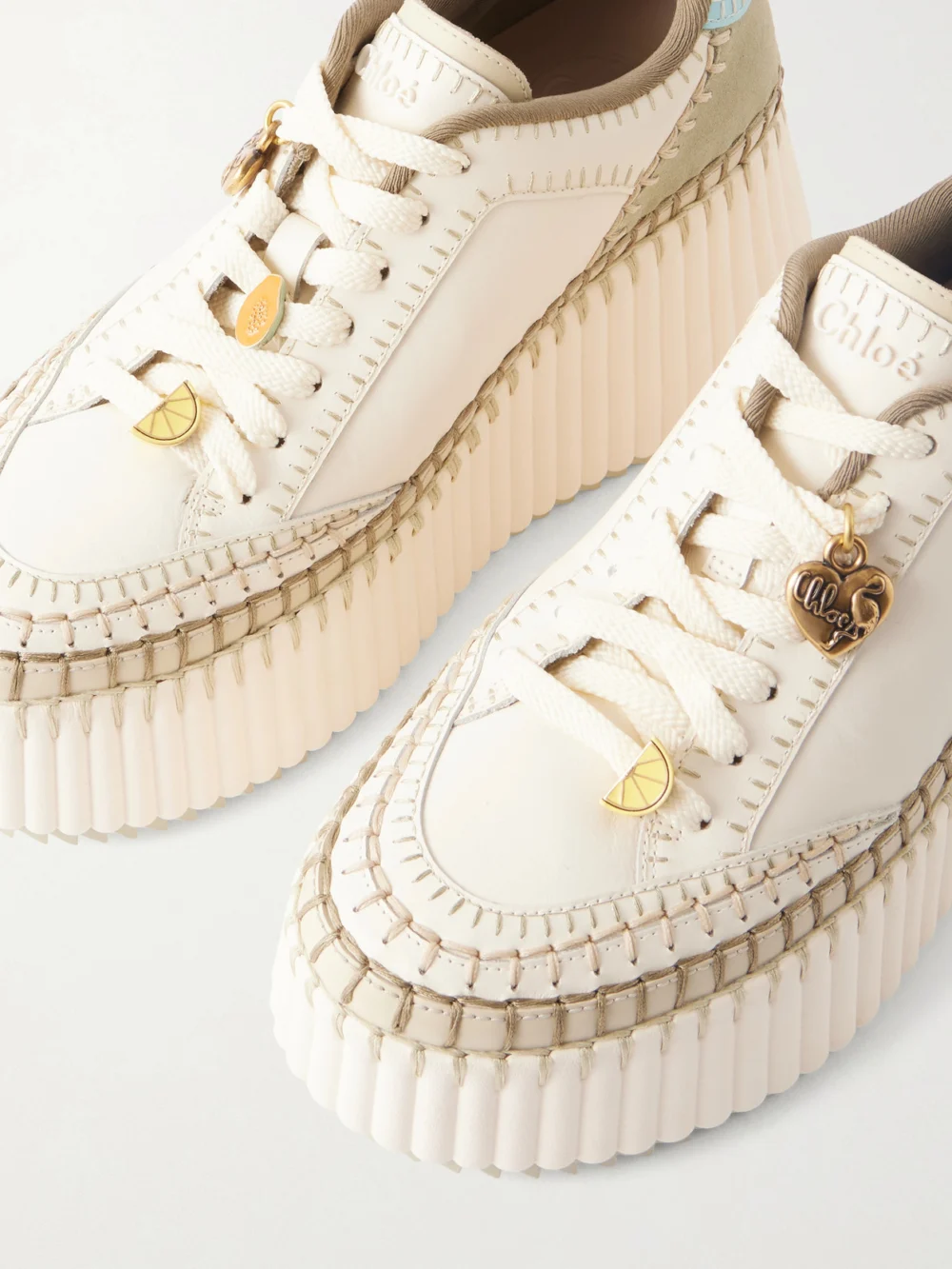 Close-up detail of the Chloé Nama Patchwork Suede-trimmed Leather Platform Sneakers