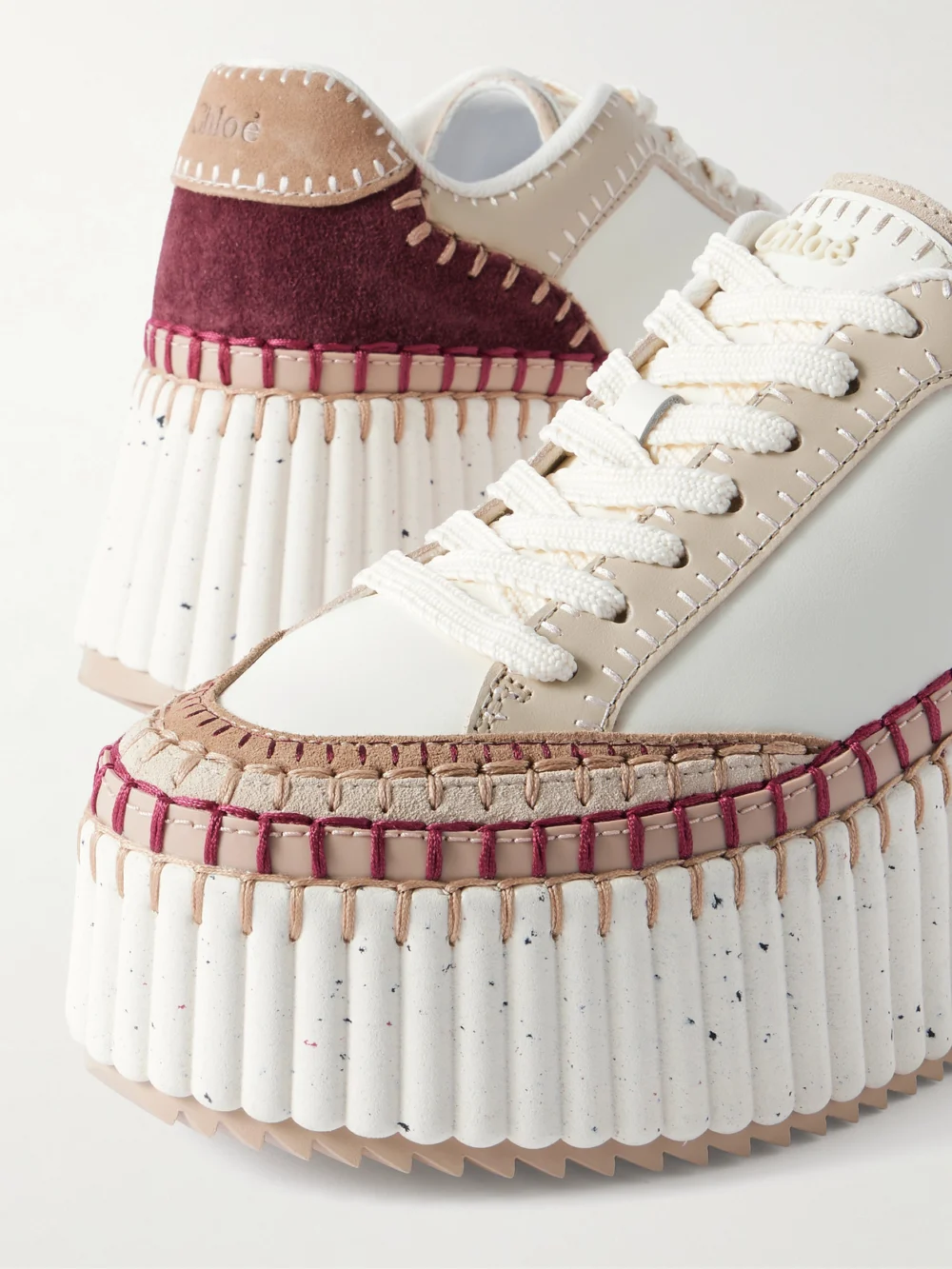 Close-up detail of the Chloé Nama Suede-trimmed Leather Platform Sneakers