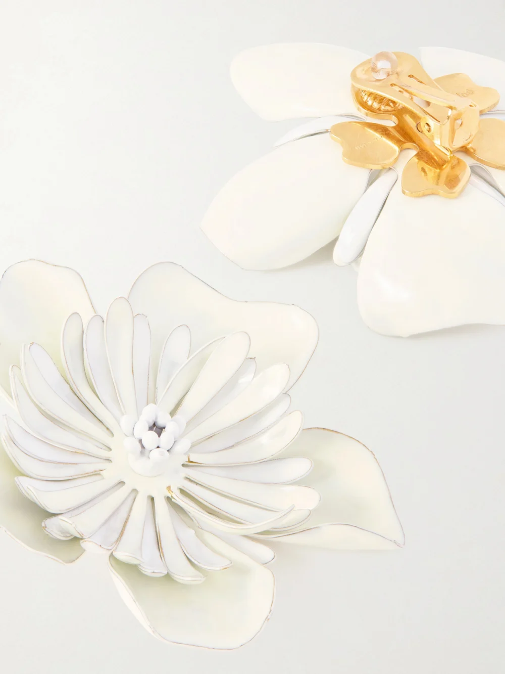 Close-up detail of the Chloé Oversized Resin Clip Earrings