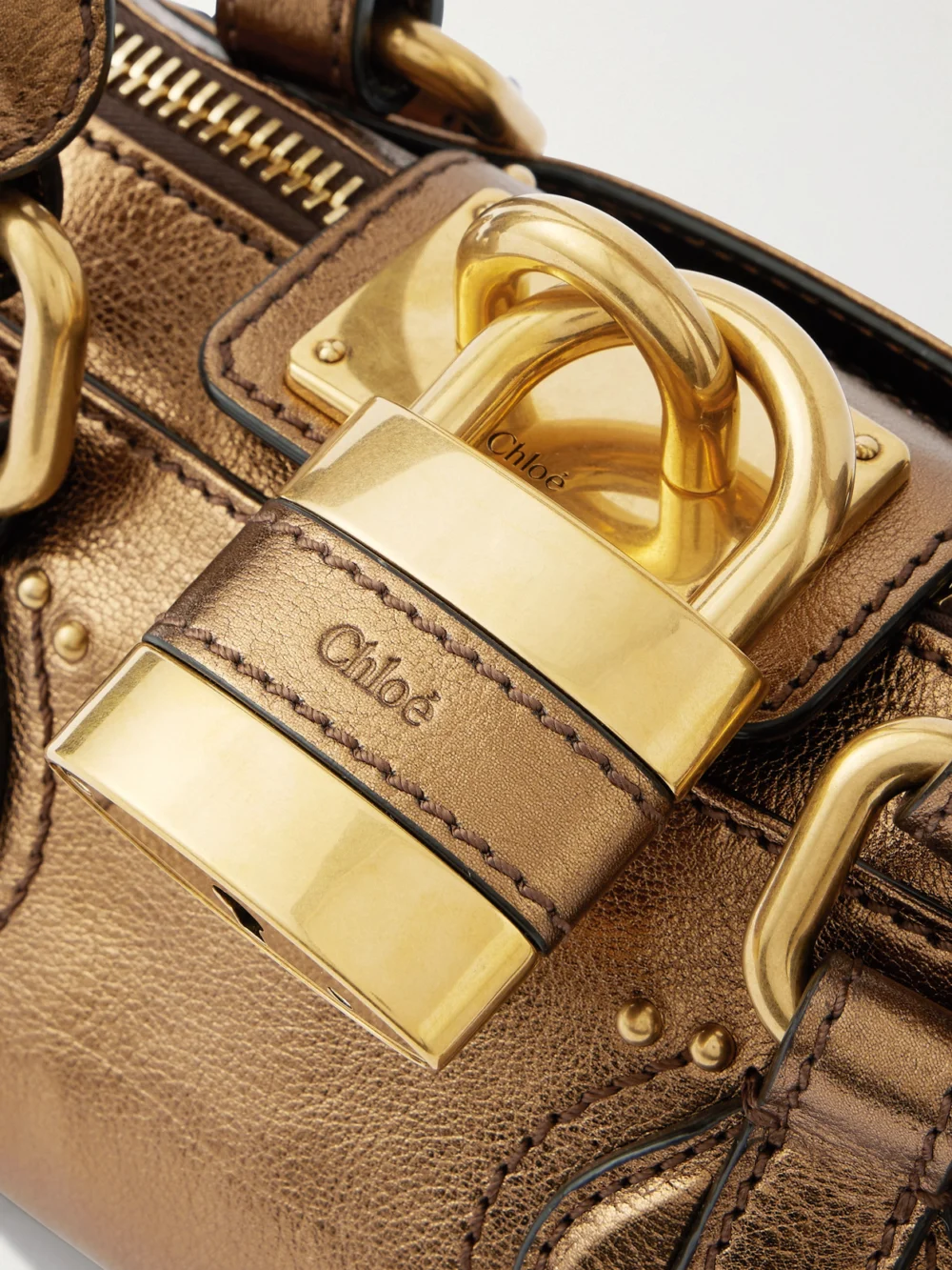 Close-up detail of the Chloé Paddington Embellished Crinkled-leather Top-handle Bag