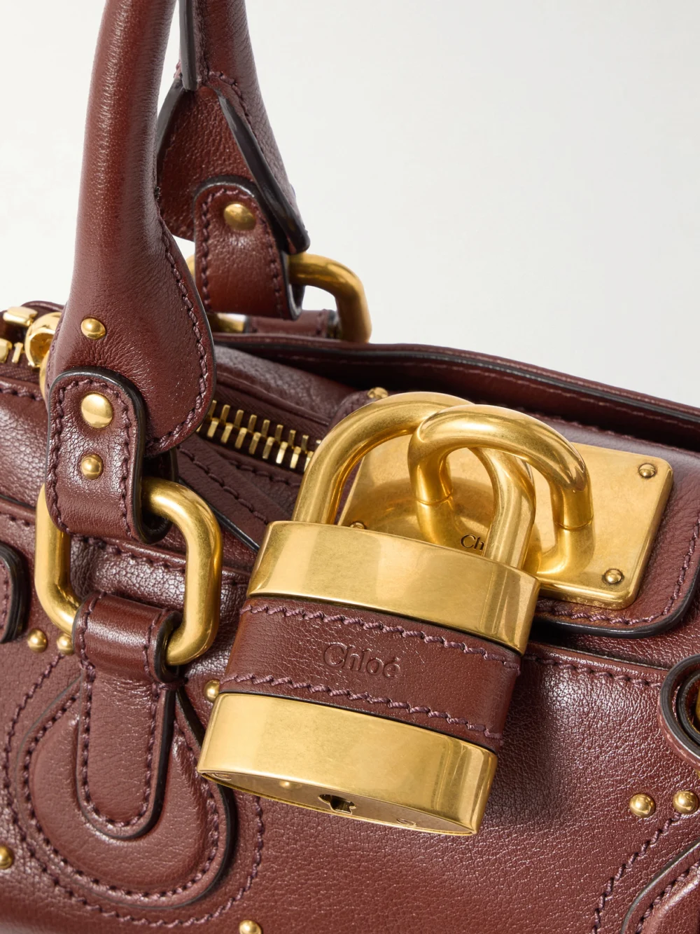 Close-up detail of the Chloé Paddington Embellished Leather Top-handle Bag
