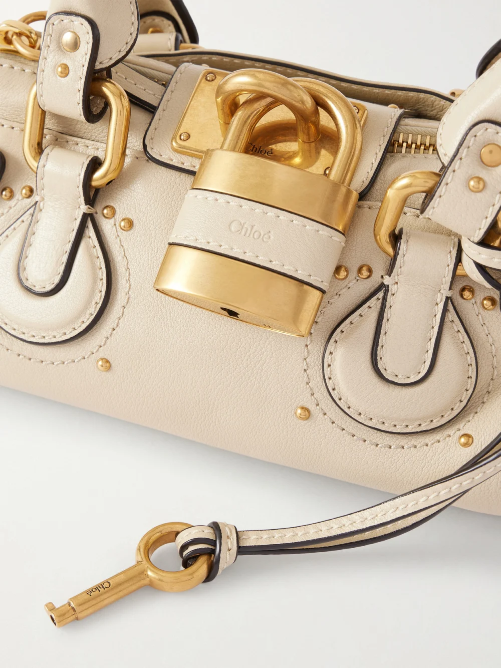 Close-up detail of the Chloé Paddington Embellished Leather Top-handle Bag