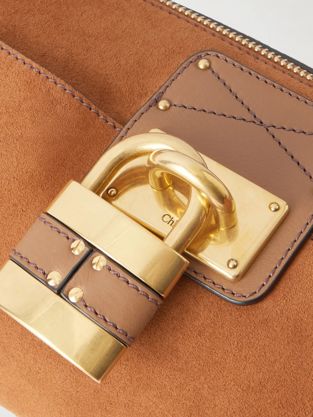 Close-up detail of the Chloé Paddington Embellished Leather-trimmed Suede Shoulder Bag