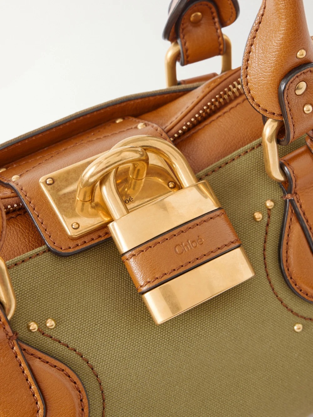 Close-up detail of the Chloé Paddington Leather-trimmed Canvas Shoulder Bag