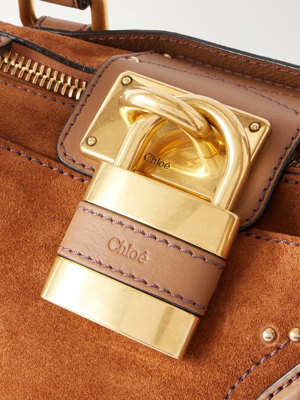 Close-up detail of the Chloé Paddington Leather-trimmed Suede Shoulder Bag