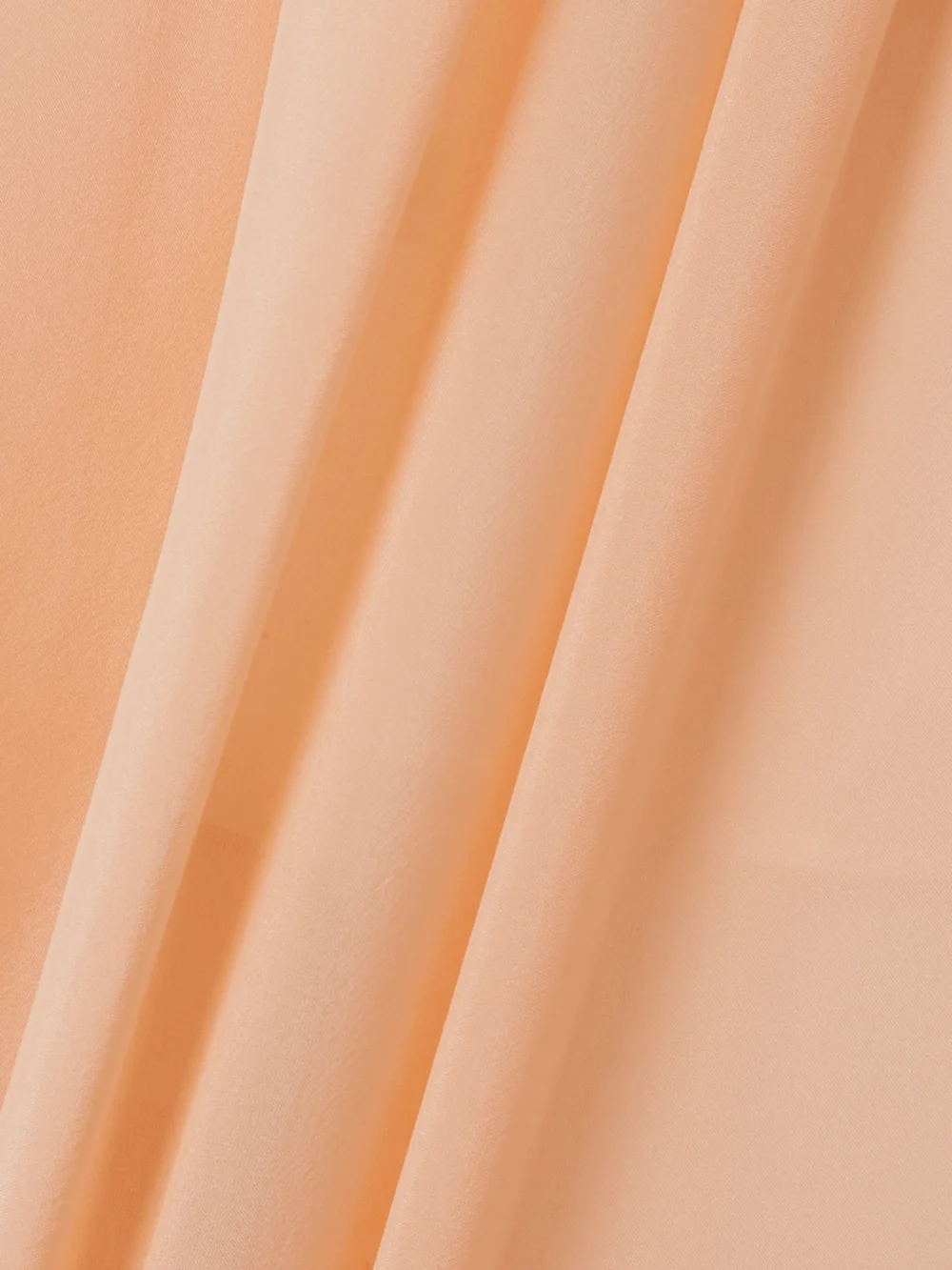Close-up detail of the Chloé Pleated Silk-charmeuse Tapered Pants