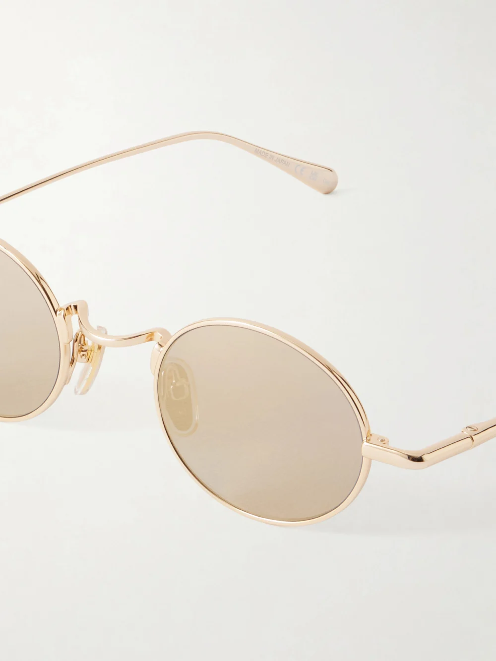 Close-up detail of the Chloé Round-frame Gold-tone Metal Sunglasses