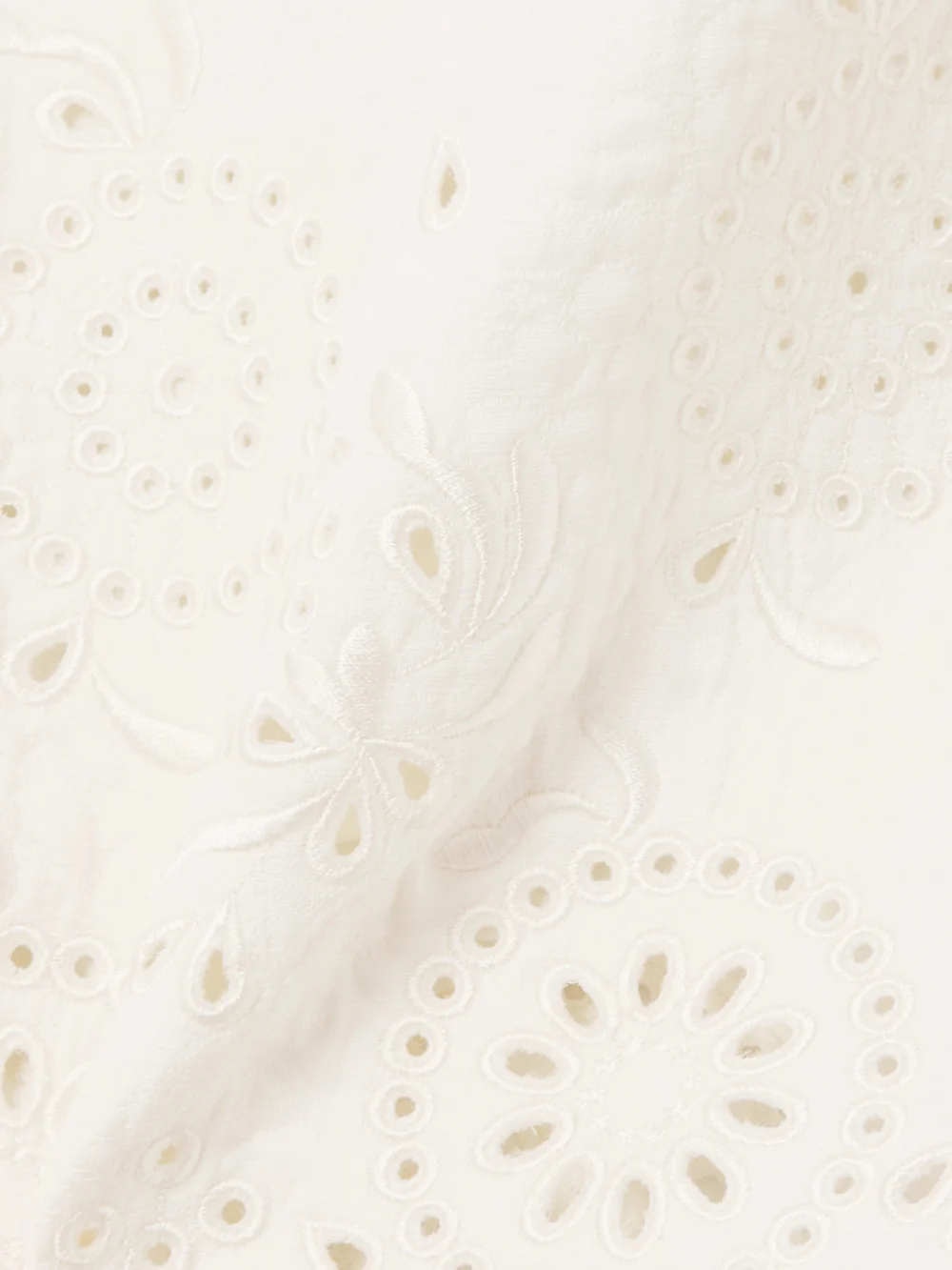 Close-up detail of the Chloé Scalloped Quilted Broderie Anglaise Cotton-blend Mini Skirt