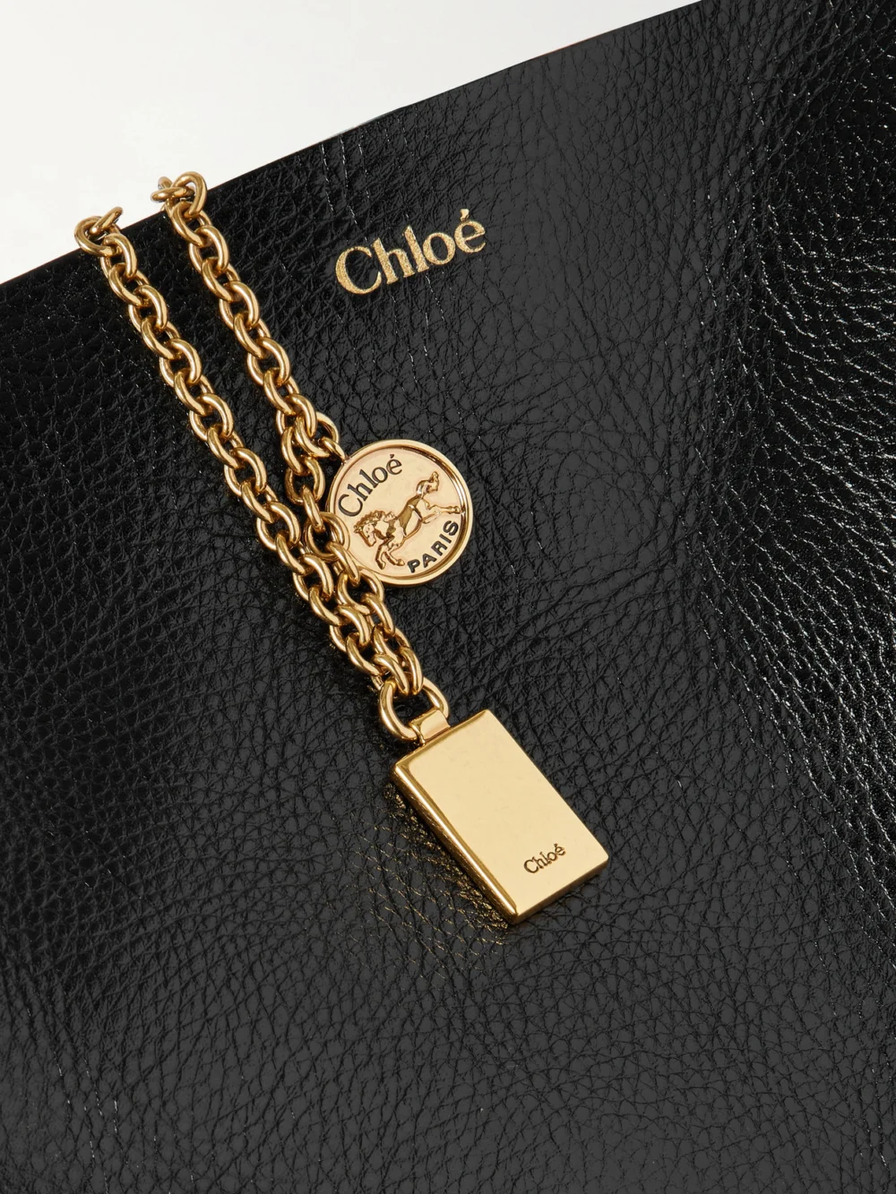 Close-up detail of the Chloé Spin Embellished Paneled Textured-leather Tote