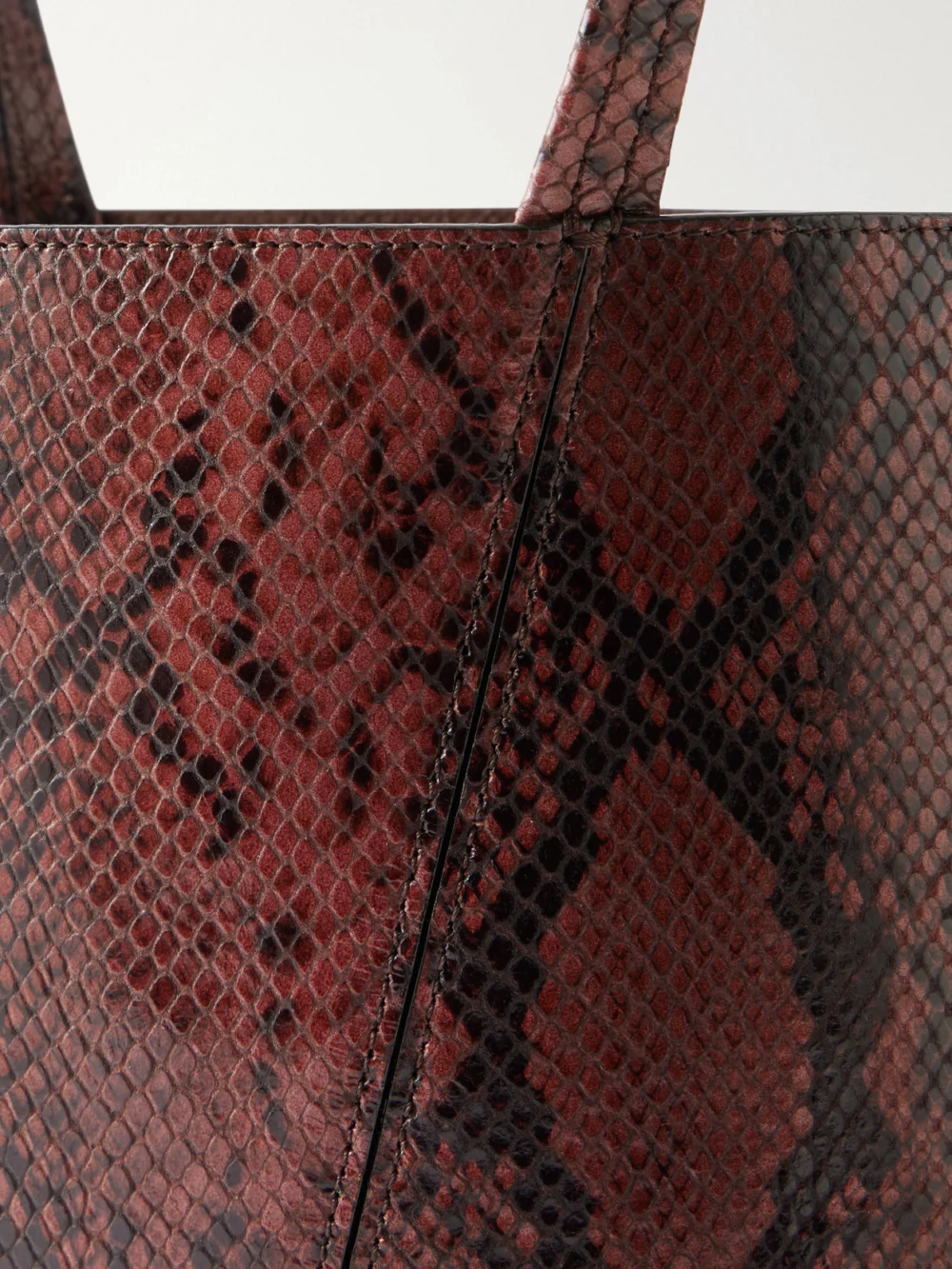 Close-up detail of the Chloé Spin Embellished Snake-effect Leather Tote