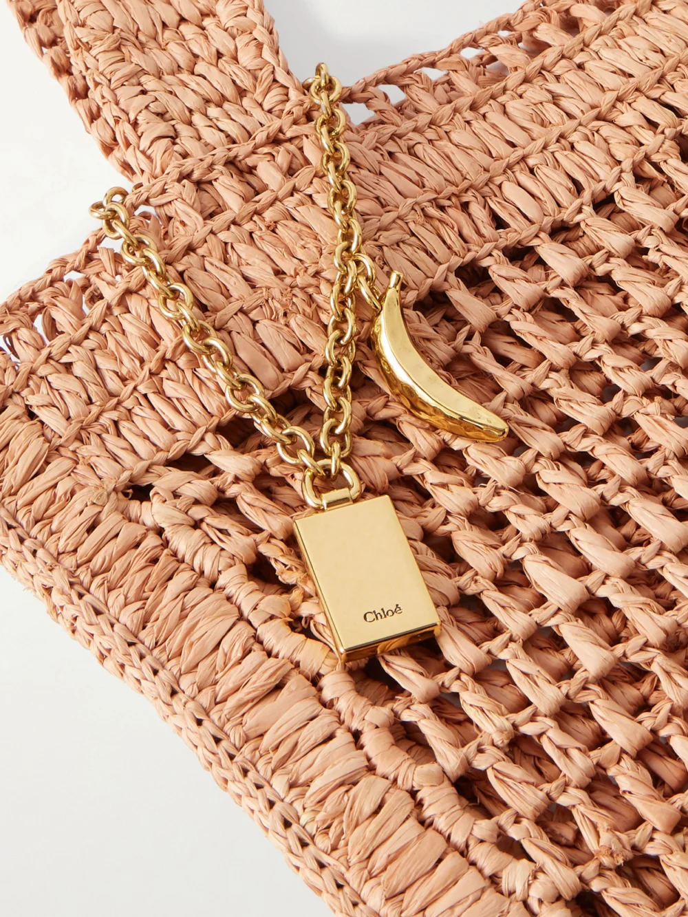 Close-up detail of the Chloé Summer Banana Embellished Crocheted Embroidered Raffia-like Tote