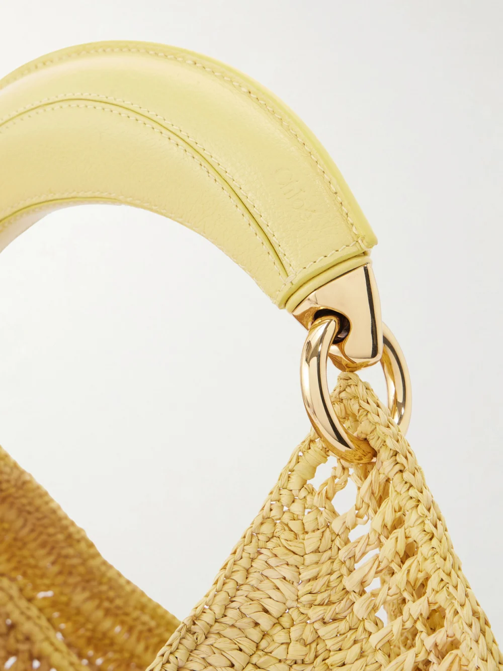 Close-up detail of the Chloé Summer Banana Leather-trimmed Embroidered Raffia Tote