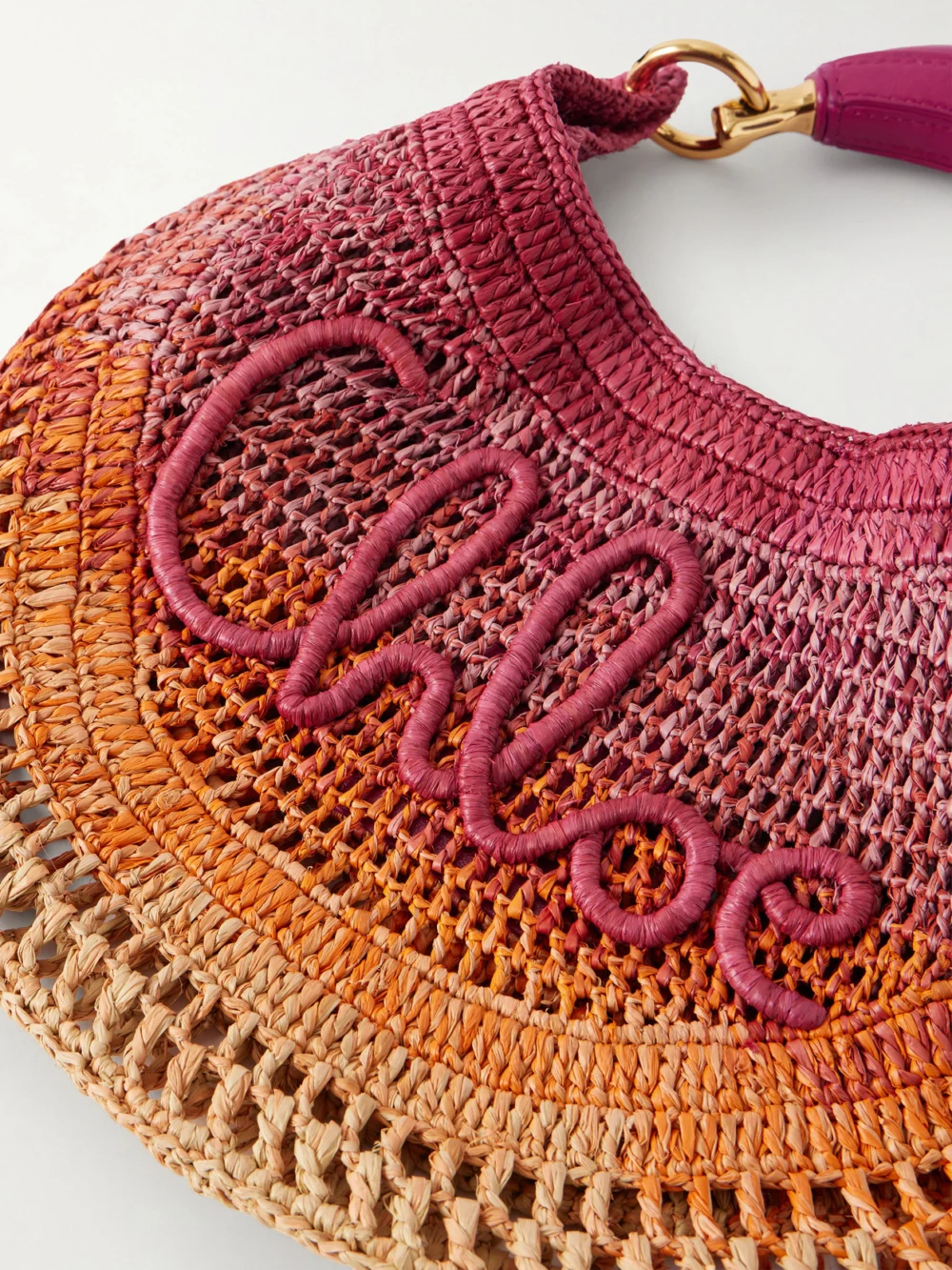 Close-up detail of the Chloé Summer Banana Leather-trimmed Embroidered Raffia Tote