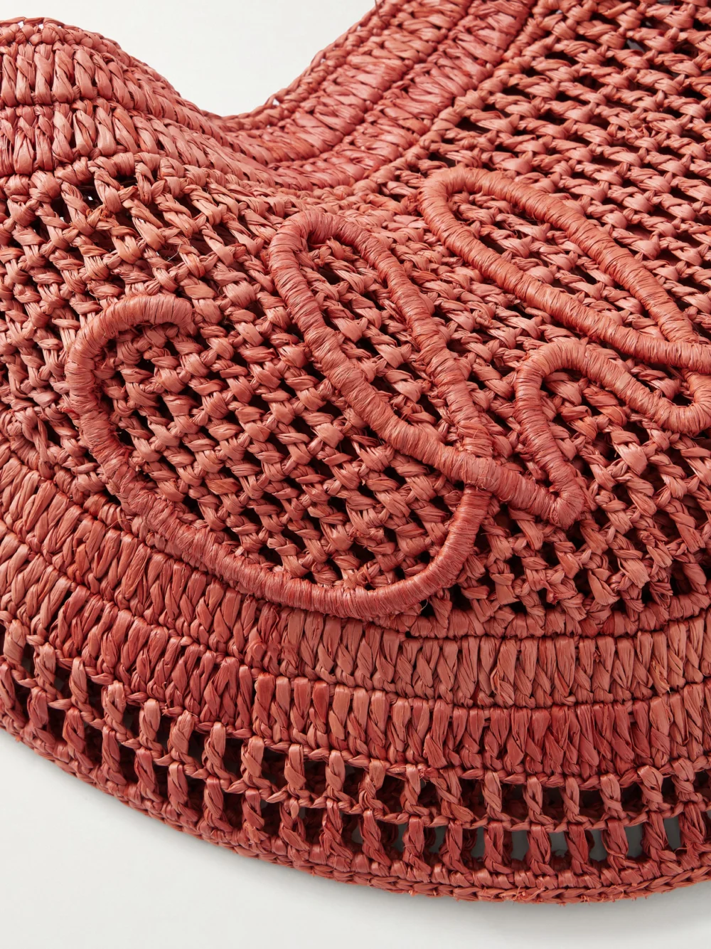 Close-up detail of the Chloé Summer Banana Leather-trimmed Embroidered Raffia Tote