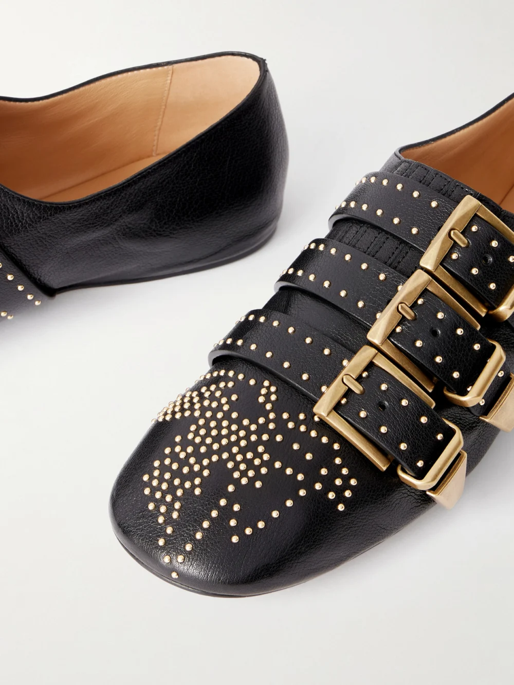 Close-up detail of the Chloé Susan Studded Buckled Leather Flats