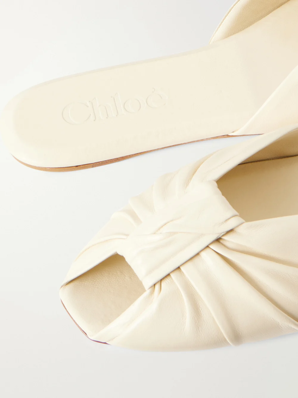 Close-up detail of the Chloé Suzie Ruched Leather Slides
