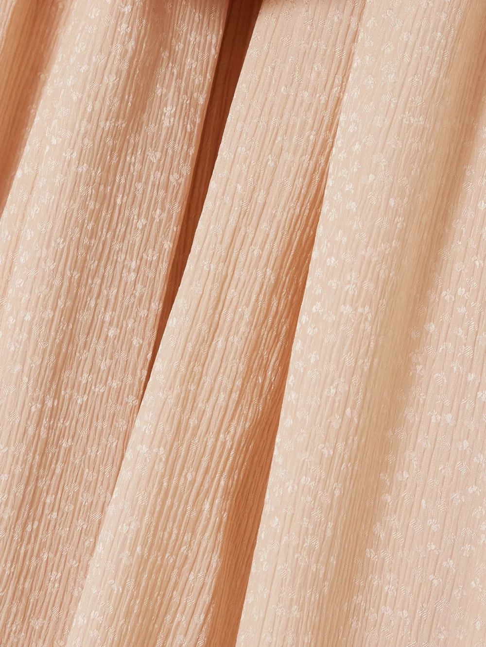 Close-up detail of the Chloé Tie-detailed Gathered Silk-blend Jacquard Blouse