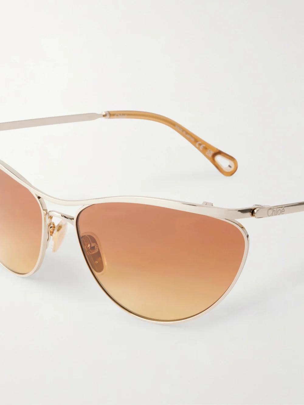 Close-up detail of the Chloé Uma Cat-eye Gold-tone Sunglasses