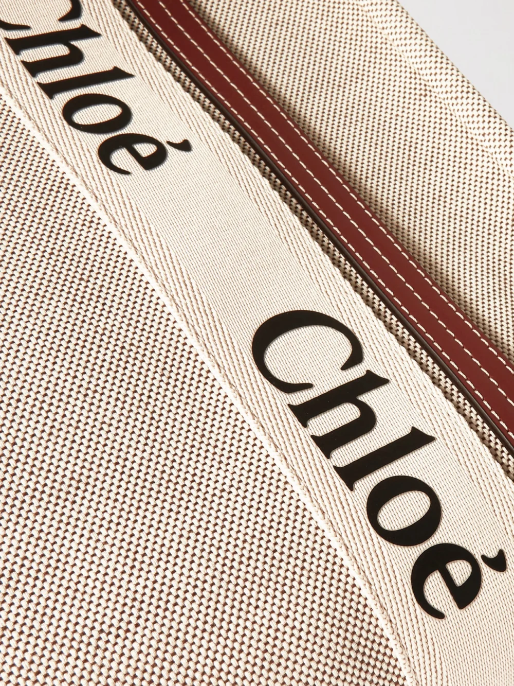 Close-up detail of the Chloé Woody Medium Leather and Webbing-trimmed Linen Tote