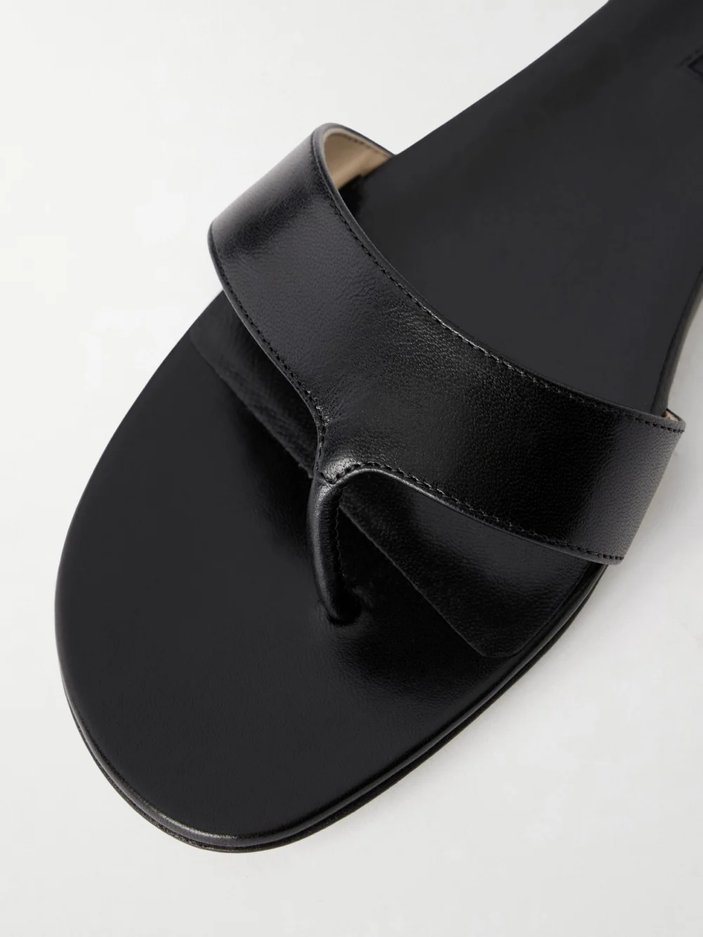 Close-up detail of the Christen Helix Leather Thong Sandals