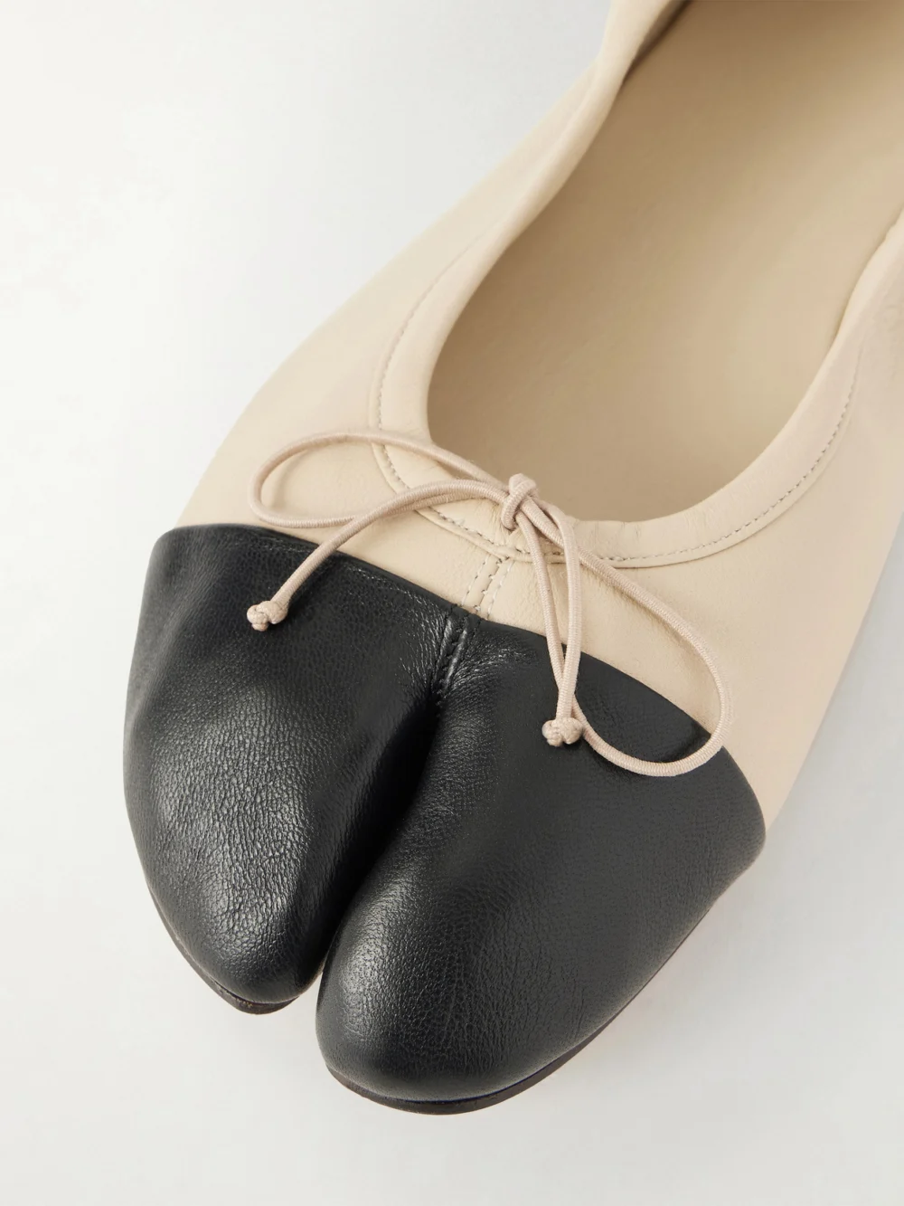 Close-up detail of the Christen Tabi Split-toe Leather Ballet Flats