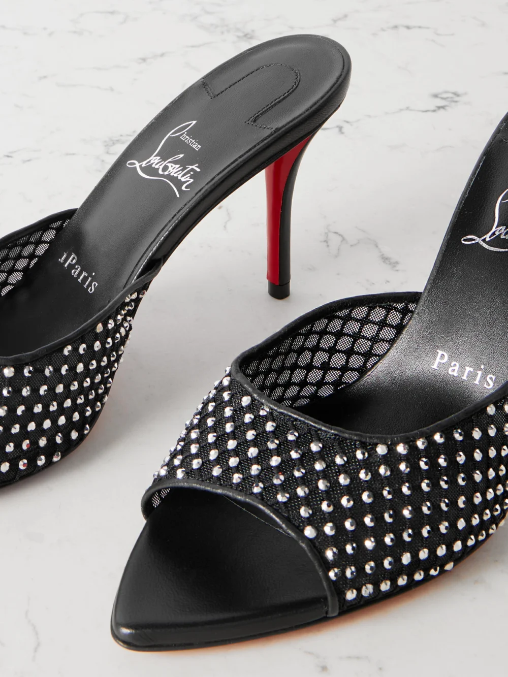 Close-up detail of the Christian Louboutin Apostropha 80 Crystal-embellished Leather-trimmed Mesh Mules