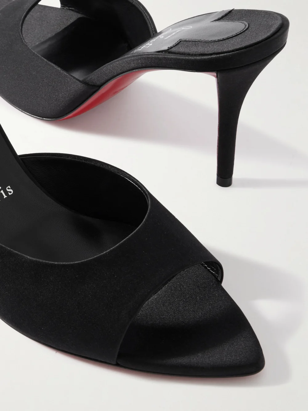 Close-up detail of the Christian Louboutin Apostropha 80 Satin Mules