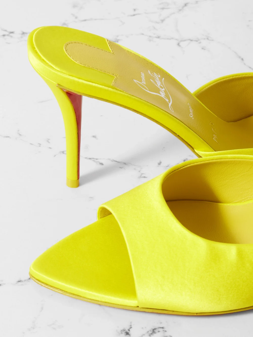 Close-up detail of the Christian Louboutin Apostropha 80 Satin Mules