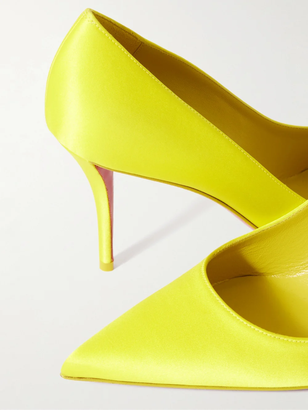 Close-up detail of the Christian Louboutin Apostropha 80 Satin Pumps