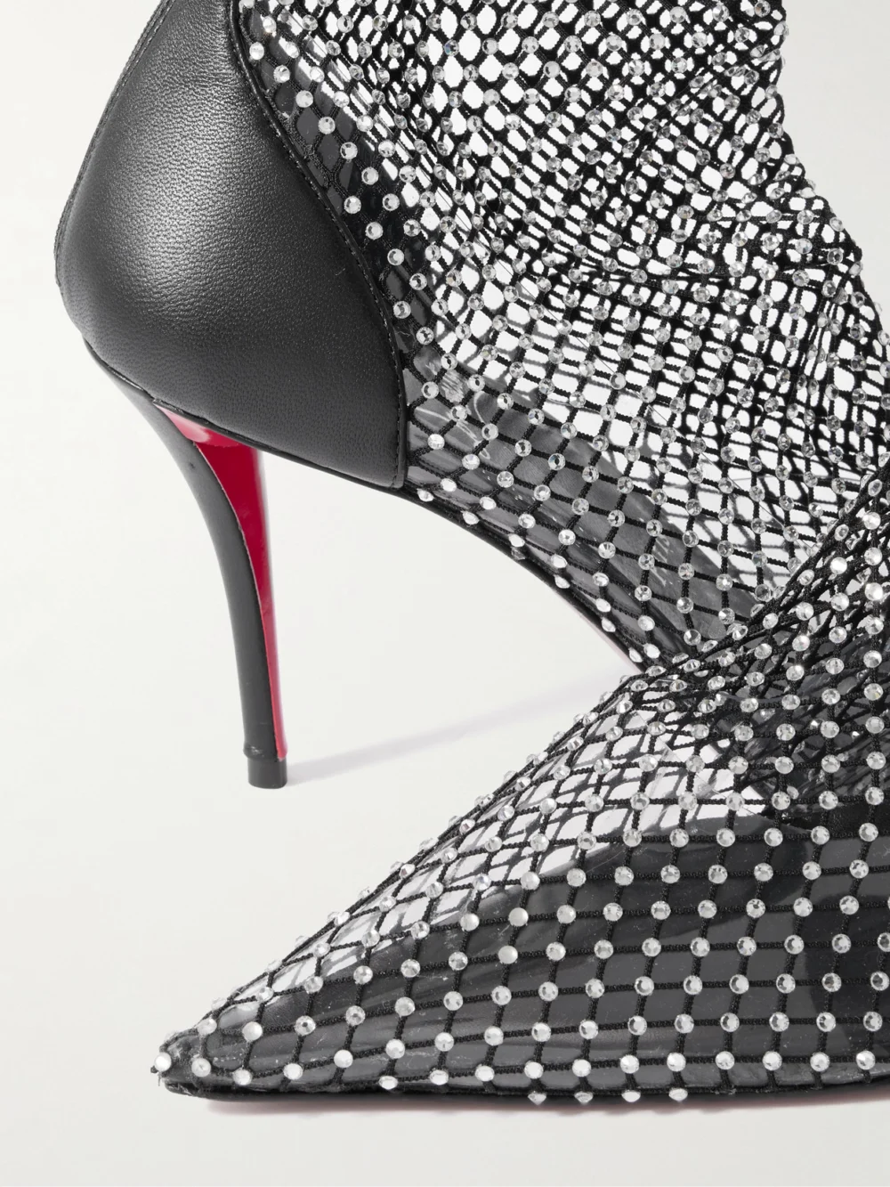 Close-up detail of the Christian Louboutin Apostropha 85 Crystal-embellished Leather-trimmed Mesh Knee Boots