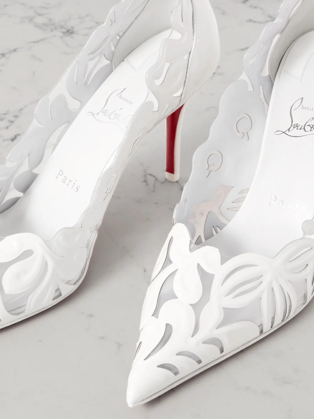Close-up detail of the Christian Louboutin Apostropha Petunia 80 Leather and Pvc Pumps