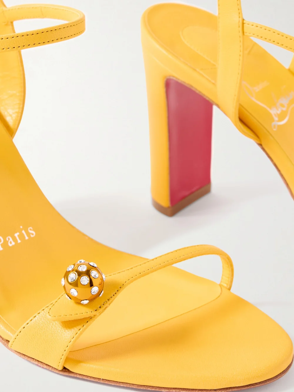 Close-up detail of the Christian Louboutin Atmospheria 85 Embellished Leather Sandals