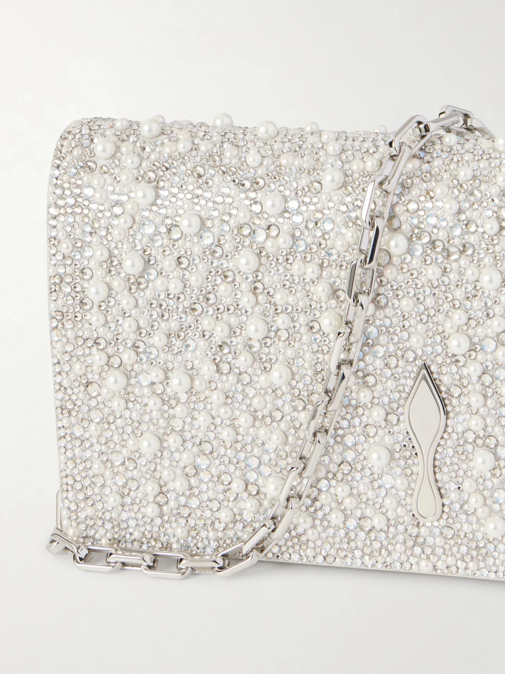 Close-up detail of the Christian Louboutin Bettina Embellished Metallic Leather Clutch