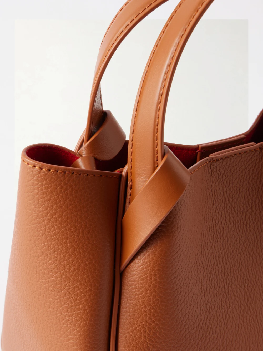Close-up detail of the Christian Louboutin Bettina Mini Embellished Leather Top Handle Bag