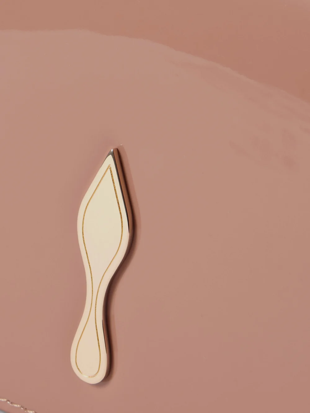 Close-up detail of the Christian Louboutin Bettina Patent-leather Clutch