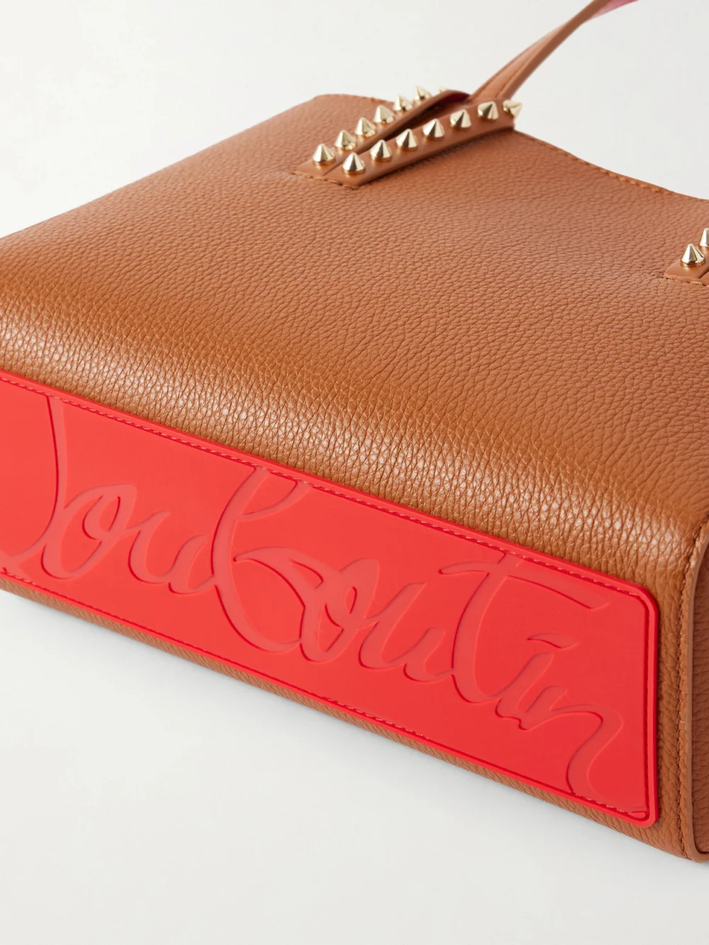 Close-up detail of the Christian Louboutin Cabata Mini Spiked Textured-leather Tote