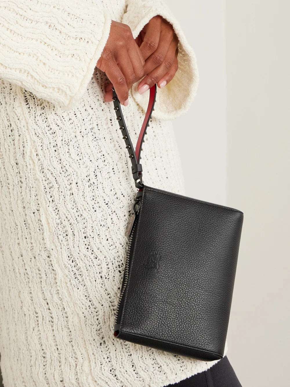 Christian Louboutin Cabata Studded Textured-leather Clutch, styled view