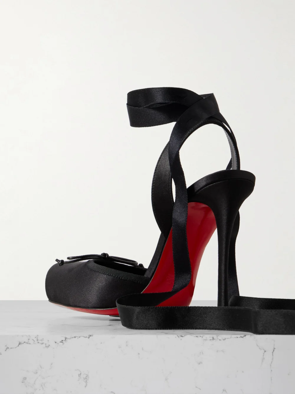 Back view of the Christian Louboutin Cassia 100 Bow-detailed Grosgrain-trimmed Satin-crepe Pumps