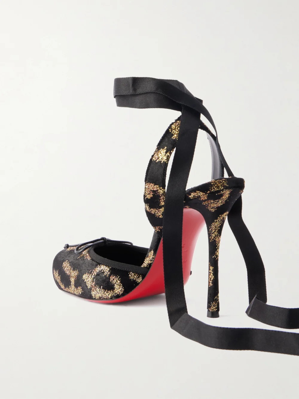 Back view of the Christian Louboutin Cassia 100 Bow-detailed Satin-trimmed Fil Coupé Velvet Pumps