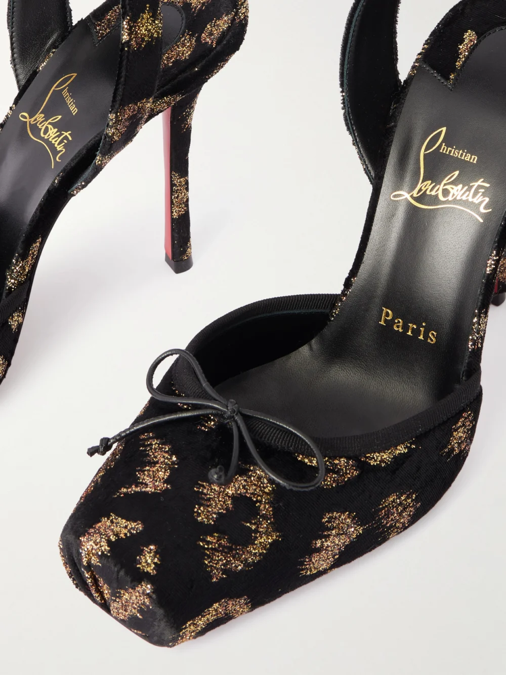 Close-up detail of the Christian Louboutin Cassia 100 Bow-detailed Satin-trimmed Fil Coupé Velvet Pumps