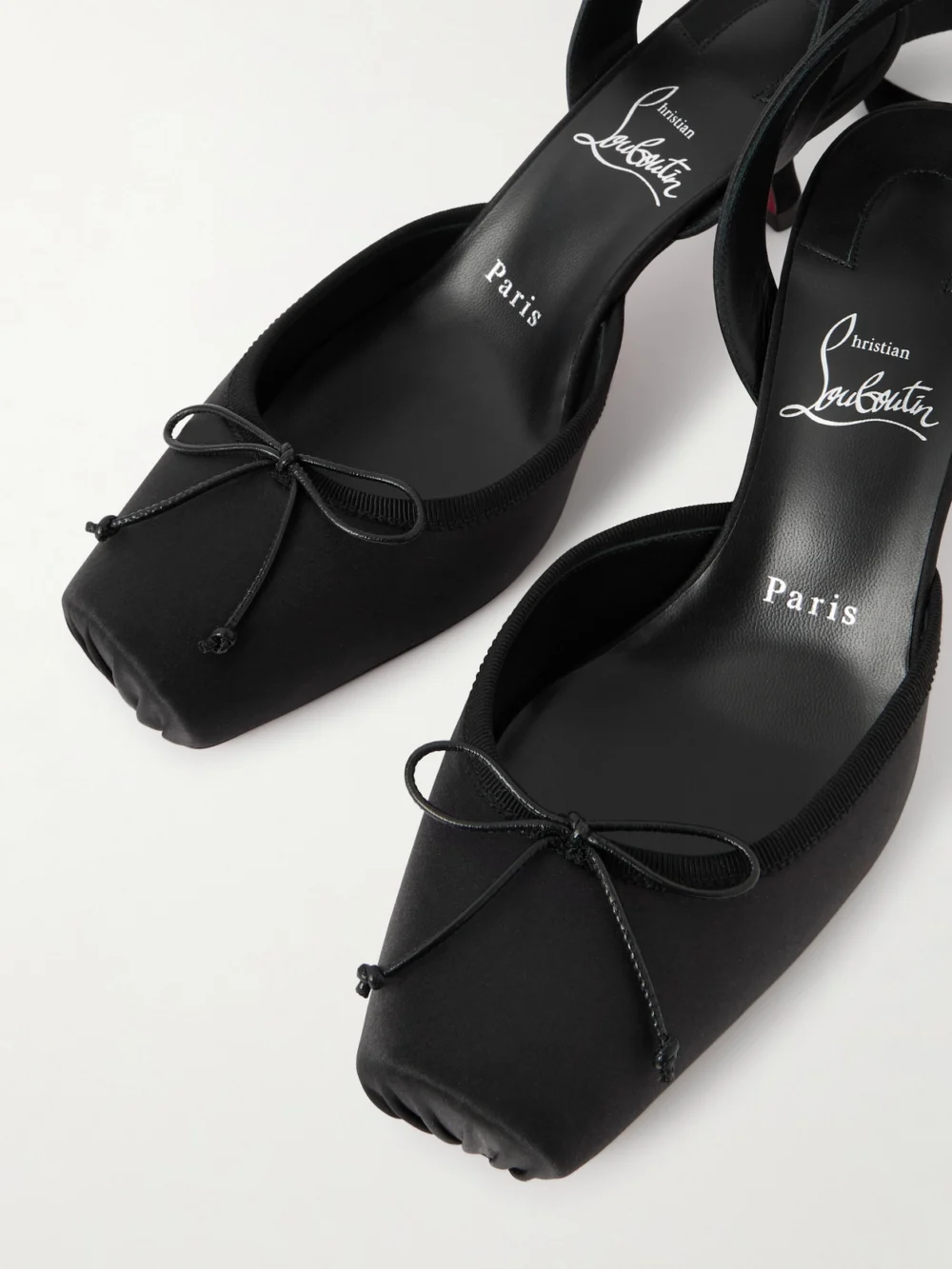 Close-up detail of the Christian Louboutin Cassia 55 Bow-detailed Grosgrain-trimmed Satin Pumps