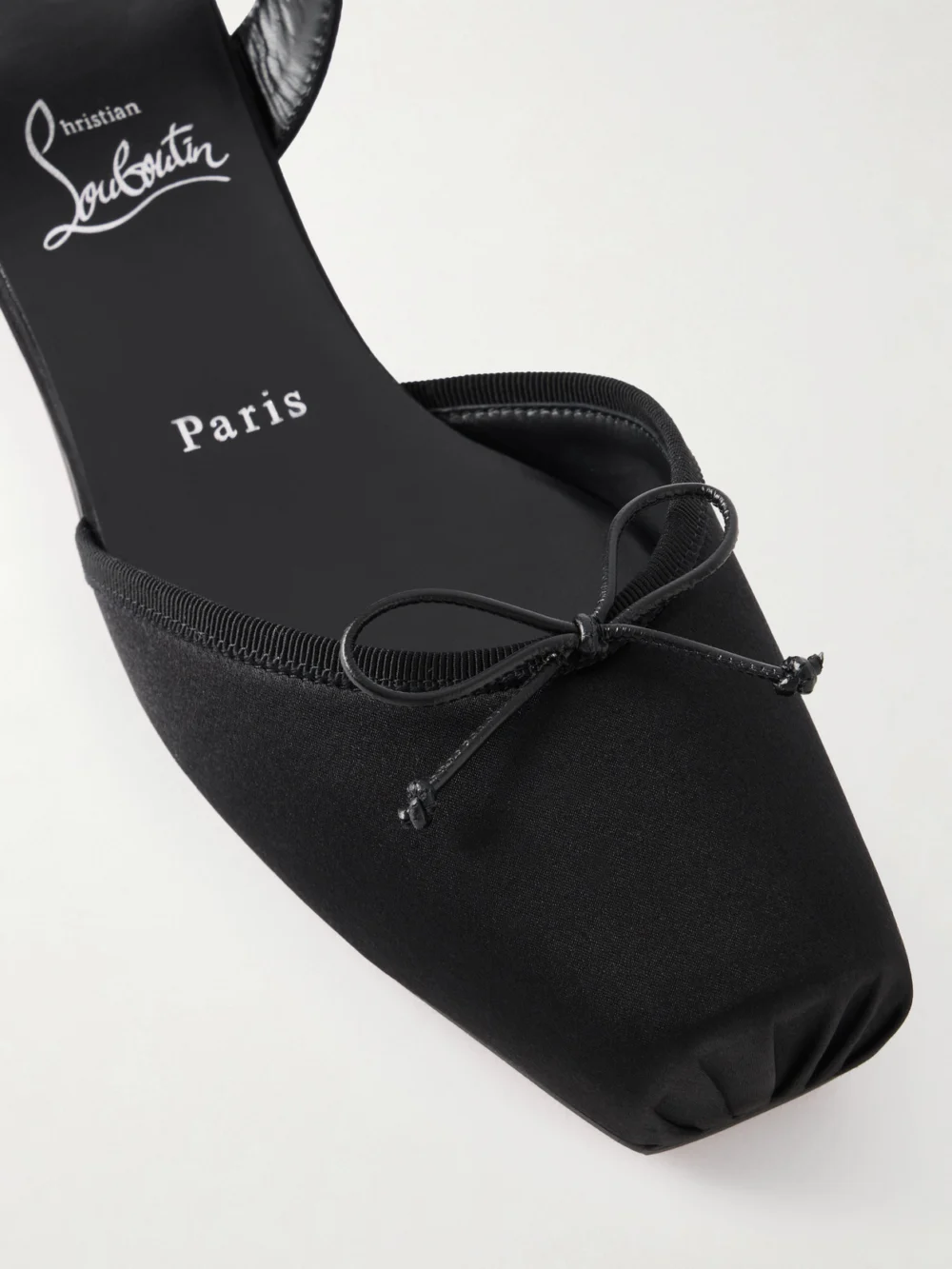 Close-up detail of the Christian Louboutin Cassia Bow-detailed Grosgrain-trimmed Satin Flats