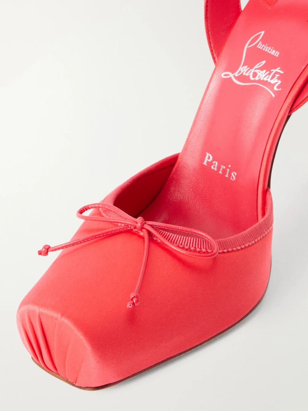 Close-up detail of the Christian Louboutin Cassia Lace Up 100 Crepe Satin Squared Toe Ballerina Pump