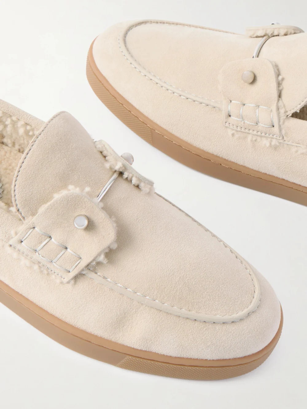 Close-up detail of the Christian Louboutin Chambeliboat Shearling-lined Suede Loafers