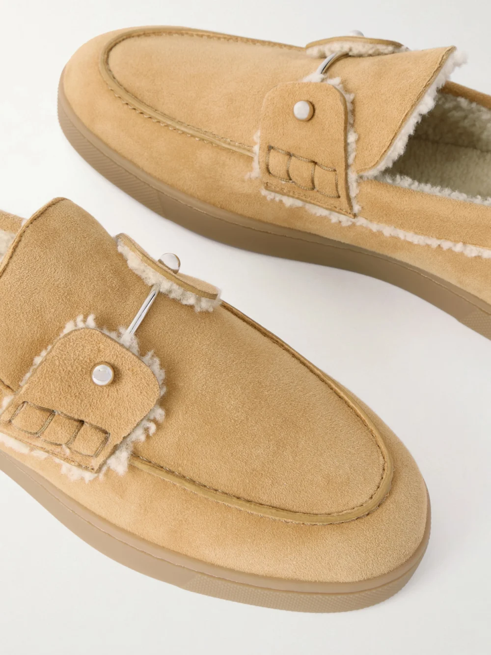 Close-up detail of the Christian Louboutin Chambeliboat Shearling-lined Suede Loafers