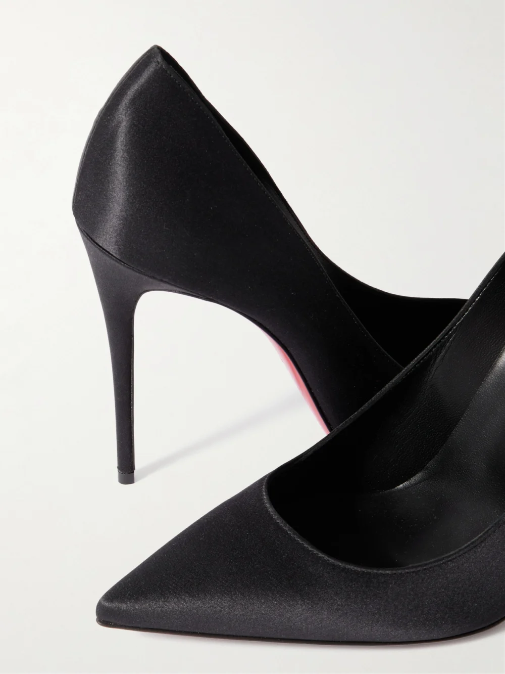 Close-up detail of the Christian Louboutin Classic Kate 100 Satin-crepe Pumps