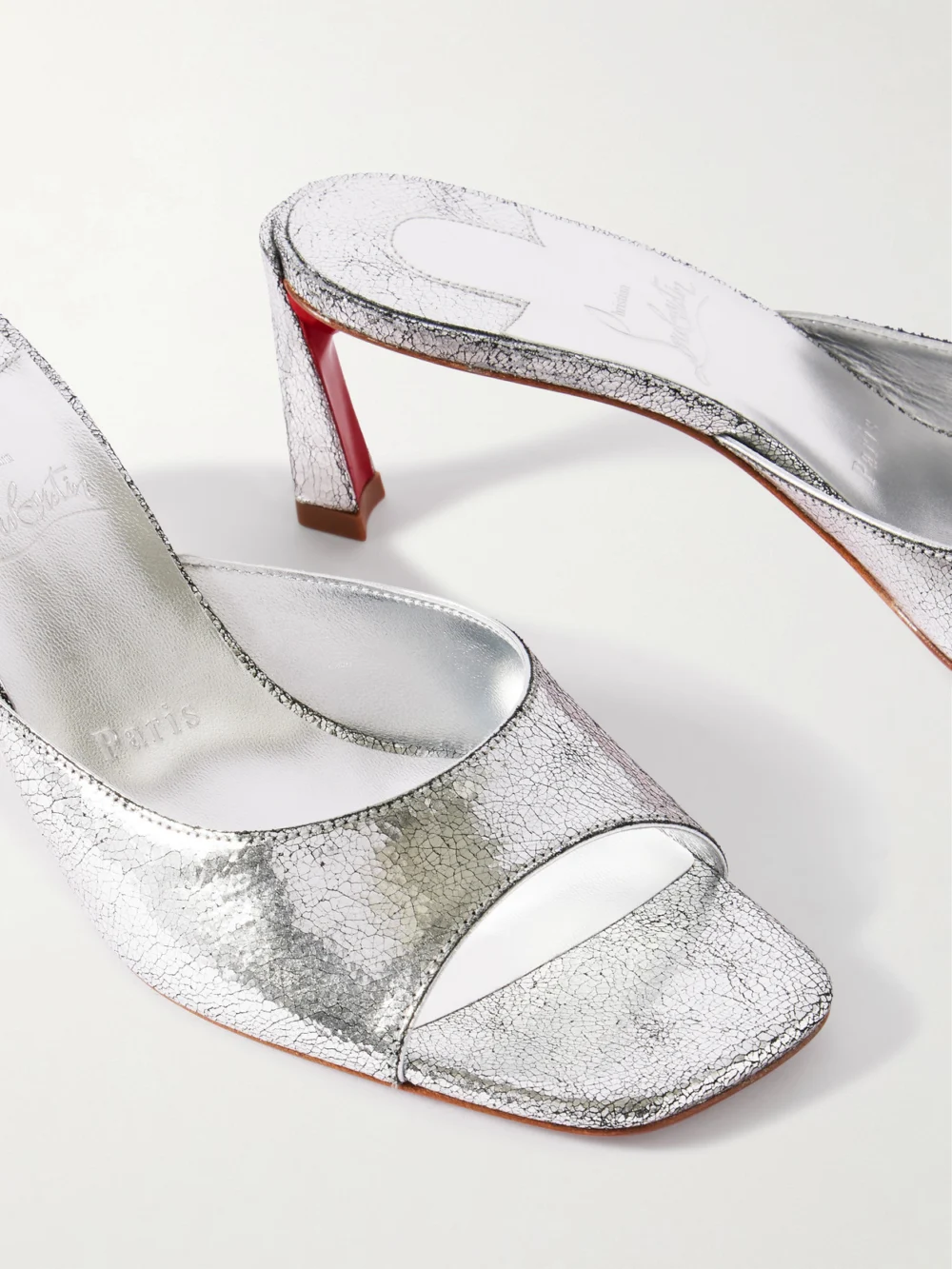 Close-up detail of the Christian Louboutin Condora 55 Metallic Cracked-leather Mules
