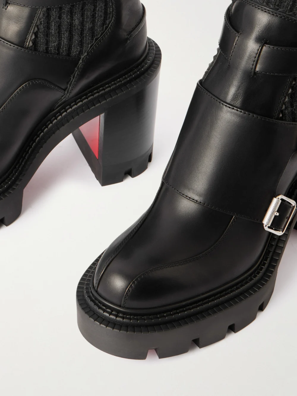Close-up detail of the Christian Louboutin Cortinetta College 100 Ribbed-knit Trimmed Leather Ankle Boots